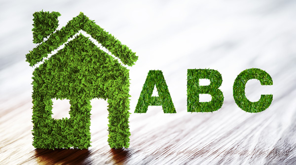 casa di erba e scritta ABC